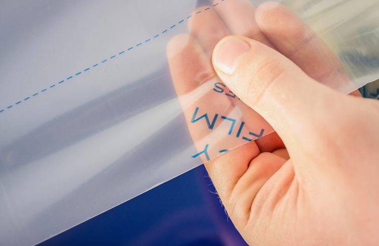 Highly transparent laser protection film for cosntant quality control